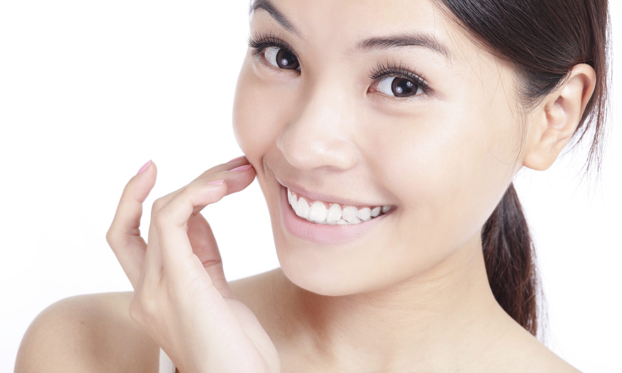 Young woman smiling with perfect dental health